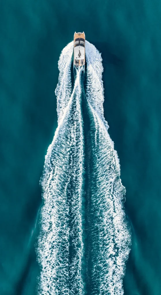 Aerial view of Elysian catamaran sailing at sea, built by Mason Marine Industries