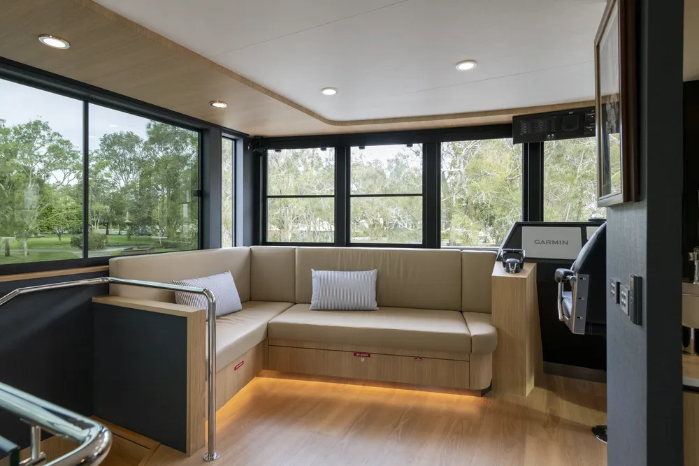 Interior lounge view of a houseboat built by Mason Marine Industries