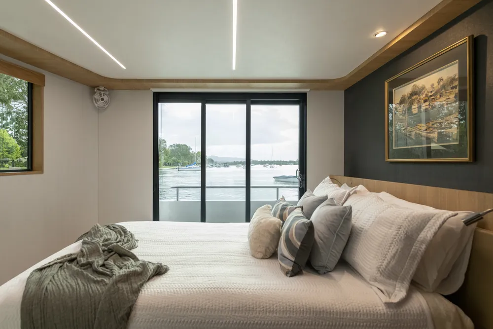 Interior bedroom view of a houseboat built by Mason Marine Industries
