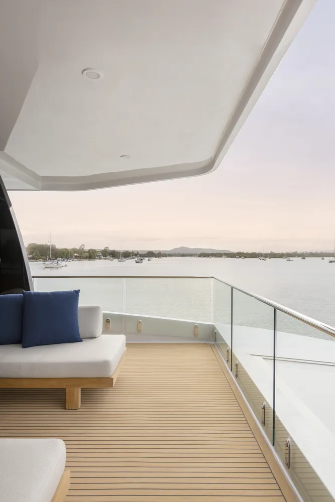 Exterior deck view of a houseboat built by Mason Marine Industries, showing sunset